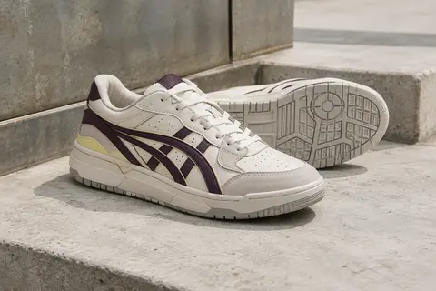 Sneaker Asics EX89 en cuir superposé, photographiée seule avec sa semelle graphique visible.